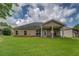 Spacious backyard with a covered patio, ideal for outdoor entertaining at 9187 Plantation Cir, Covington, GA 30014