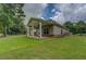 House featuring a covered patio and large yard at 9187 Plantation Cir, Covington, GA 30014