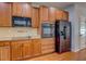 Updated kitchen with stainless steel appliances, granite countertops, and ample cabinet space at 9187 Plantation Cir, Covington, GA 30014