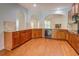 Bright kitchen with granite countertops and wooden cabinets offering ample storage space at 9187 Plantation Cir, Covington, GA 30014