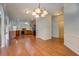 Bright open floor plan with kitchen and living area, featuring hardwood floors at 9187 Plantation Cir, Covington, GA 30014