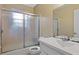 Bathroom featuring a shower with glass doors, vanity, sink, and toilet at 1513 Dupree Rd, Woodstock, GA 30189