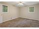 Bedroom featuring neutral walls, plush carpeting, and natural light from two windows at 1513 Dupree Rd, Woodstock, GA 30189