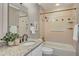 Bathroom featuring an extended vanity with granite countertop and a shower-tub combo at 1693 Alderbrook Ne Rd, Atlanta, GA 30345