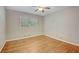 Empty bedroom featuring hardwood floors, a window, and neutral paint at 1693 Alderbrook Ne Rd, Atlanta, GA 30345