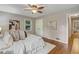 Bright bedroom featuring a ceiling fan, hardwood floors, and neutral paint at 1693 Alderbrook Ne Rd, Atlanta, GA 30345