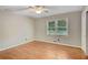 Empty bedroom featuring hardwood floors, a window, and neutral paint at 1693 Alderbrook Ne Rd, Atlanta, GA 30345