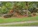Charming brick home with a beautifully landscaped front yard and mature trees at 1693 Alderbrook Ne Rd, Atlanta, GA 30345