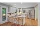 Modern kitchen with white cabinets, stainless appliances, and a large center island at 1693 Alderbrook Ne Rd, Atlanta, GA 30345