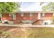 Back view of a brick multifamily home with individual entrances and AC units at 5952 Medlock Ave, Austell, GA 30106