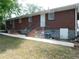 Brick multifamily with back entrances and stairs leading up to each unit at 5952 Medlock Ave, Austell, GA 30106