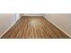 Basement features wood floors, grey walls, and a white door and trim at 5952 Medlock Ave, Austell, GA 30106