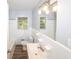 Bathroom with tile, a large mirror, and modern lighting fixtures at 5952 Medlock Ave, Austell, GA 30106