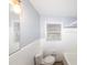 Bright bathroom featuring a window, single sink, and tiled shower and flooring at 5952 Medlock Ave, Austell, GA 30106