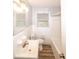 Bright bathroom featuring a window, single sink, and tiled shower and flooring at 5952 Medlock Ave, Austell, GA 30106