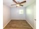 Bedroom featuring neutral paint, wood-look floors, a ceiling fan and a window at 5952 Medlock Ave, Austell, GA 30106