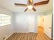 Bedroom with light walls, wood-look flooring, and a ceiling fan at 5952 Medlock Ave, Austell, GA 30106