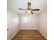 Cozy bedroom with vinyl flooring, natural light, and ceiling fan at 5952 Medlock Ave, Austell, GA 30106