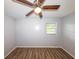 Comfortable bedroom with vinyl flooring, natural light, and ceiling fan at 5952 Medlock Ave, Austell, GA 30106