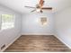 Bedroom features a ceiling fan, and a window that provides natural light at 5952 Medlock Ave, Austell, GA 30106