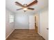 Bedroom features stylish vinyl flooring, natural light, and ceiling fan at 5952 Medlock Ave, Austell, GA 30106