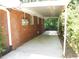 A carport with a metal covering on the side of a brick building at 5952 Medlock Ave, Austell, GA 30106