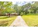 A lush green lawn and driveway leading up to the charming brick home at 5952 Medlock Ave, Austell, GA 30106