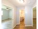 Hallway leading to rooms, showing stylish vinyl flooring and neutral color scheme at 5952 Medlock Ave, Austell, GA 30106