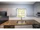 Kitchen featuring granite countertops and stainless steel sink at 5952 Medlock Ave, Austell, GA 30106