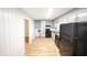 Kitchen featuring a view of the stainless steel refrigerator, wood floors, and grey cabinets at 5952 Medlock Ave, Austell, GA 30106