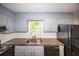 Kitchen with stainless steel sink, stone countertops, and grey cabinets at 5952 Medlock Ave, Austell, GA 30106