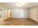 Spacious living room with multiple doorways and wood floors at 5952 Medlock Ave, Austell, GA 30106