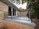 Balcony with black metal railings and sliding glass door access to the interior of the home at 2545 Glenrock Dr, Decatur, GA 30032