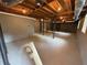 Unfinished basement with exposed ceiling beams, concrete floor, and painted walls at 2545 Glenrock Dr, Decatur, GA 30032
