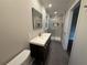 Modern bathroom featuring a floating vanity with a white countertop and a glass-enclosed shower at 2545 Glenrock Dr, Decatur, GA 30032