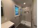 Stylish bathroom showcases a tiled shower with a glass door and a built-in niche at 2545 Glenrock Dr, Decatur, GA 30032