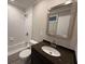 Cozy bathroom featuring a tub/shower combination with white tile surround and a granite vanity at 2545 Glenrock Dr, Decatur, GA 30032
