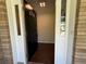 Open front door reveals hardwood floors and a glimpse of the home's interior at 2545 Glenrock Dr, Decatur, GA 30032