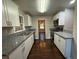 Modern kitchen boasts granite countertops, stainless steel appliances, and white cabinets at 2545 Glenrock Dr, Decatur, GA 30032