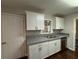 Bright kitchen showcasing white cabinets, granite countertops, and a stainless steel dishwasher at 2545 Glenrock Dr, Decatur, GA 30032