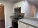 Beautiful kitchen featuring granite countertops, modern appliances, and updated white cabinets at 2545 Glenrock Dr, Decatur, GA 30032