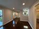 Open living area featuring updated paint, dark wood floors and modern lighting plus a view to the kitchen at 2545 Glenrock Dr, Decatur, GA 30032