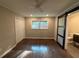 Main bedroom featuring dark wood floors, a closet, and a sliding door that leads to the en suite bathroom at 2545 Glenrock Dr, Decatur, GA 30032