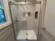 Tiled shower features a glass door and a built-in niche at 2545 Glenrock Dr, Decatur, GA 30032