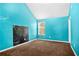 Bedroom with bold blue walls, carpeting, and a window at 273 Baywood Xing, Hiram, GA 30141
