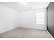 Bright bedroom featuring neutral carpeting, natural light, and white walls at 273 Baywood Xing, Hiram, GA 30141