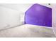 Room with vibrant purple accent wall, large window, and neutral carpet at 273 Baywood Xing, Hiram, GA 30141