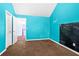 Spacious bedroom features blue walls, carpeted floors, and a chalkboard wall for creative expression at 273 Baywood Xing, Hiram, GA 30141