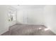 Well-lit bedroom with a window, neutral carpet, and a door leading to closet or bathroom at 273 Baywood Xing, Hiram, GA 30141