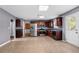 Spacious kitchen with stainless steel appliances, dark wood cabinets, and an adjoining dining area at 273 Baywood Xing, Hiram, GA 30141